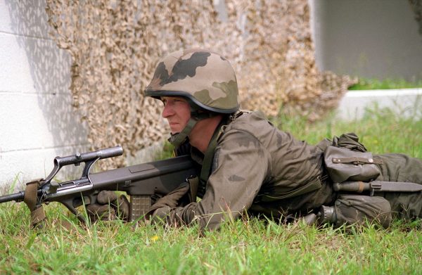 An Austrian soldier armed with a Steyr AUG rifle provides security during Final Training Exercise 2, COOPERATIVE OSPREY Ô96.  Final Training Exercise 2 consists of Military Operations in Urban Terrain, Security and Civil Disturbance Operations at Camp LeJeune, North Carolina. Cooperative Osprey is a United States Atlantic Command sponsored exercise that's conducted by Marine Forces Atlantic at Camp Lejeune, North Carolina.  Cooperative Osprey, under the Partnership for Peace program, will provide interoperability training in peacekeeping and humanitarian operations along NATO/IFOR standards, with an emphasis on individual and collective skills.  The three NATO countries providing troops are the United States, Canada, and the Netherlands.  The 16 "Partnership for Peace" nations contributing troops are Albania, Austria, Bulgaria, Estonia, Georgia, Hungary, Kazakhstan, Kyrgystan, Latvia, Lithuania, Moldova, Poland, Romania, Slovak Republic, Ukraine, and Uzbekistan.  In addition, the following countries are providing observers to the exercise: Azerbaijan, Belarus, Czech Republic, and Denmark.